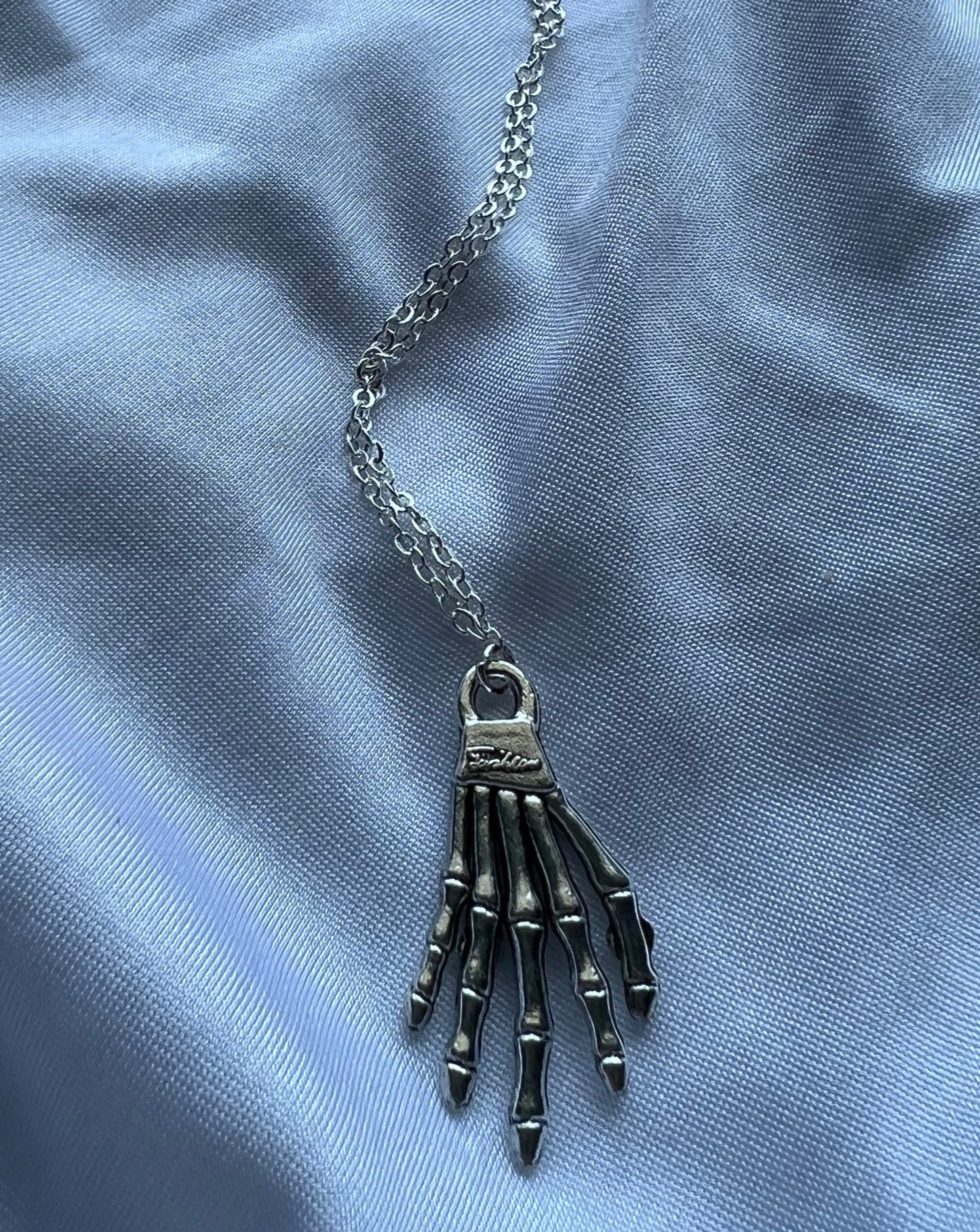 skeleton hand necklace