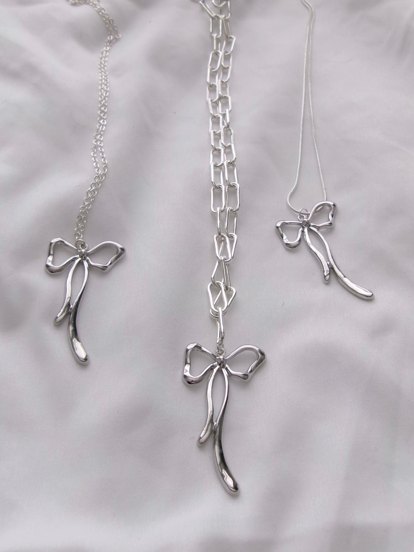 new silver long bow necklace