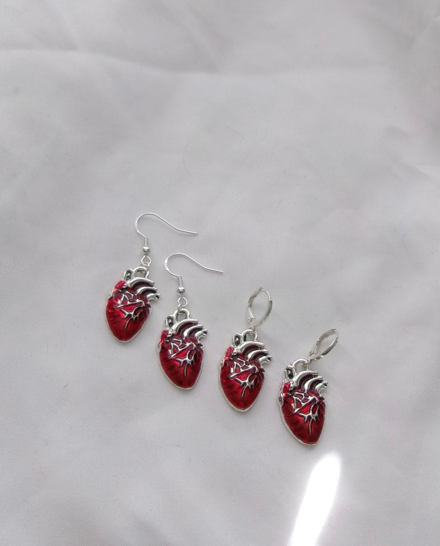 realistic heart earrings