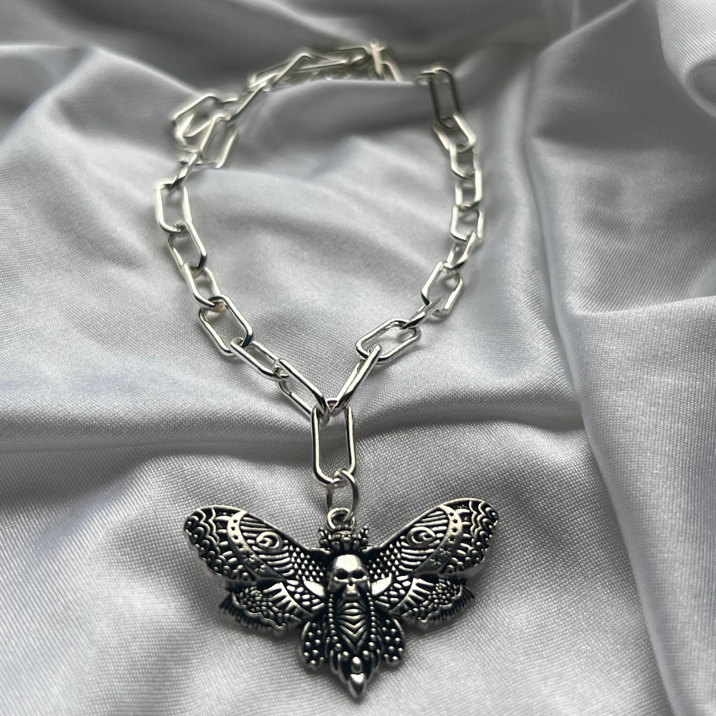 skeleton moth necklace