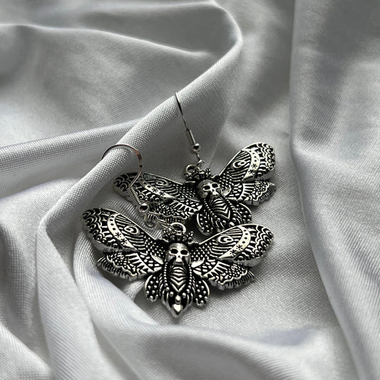 skeleton moth earrings