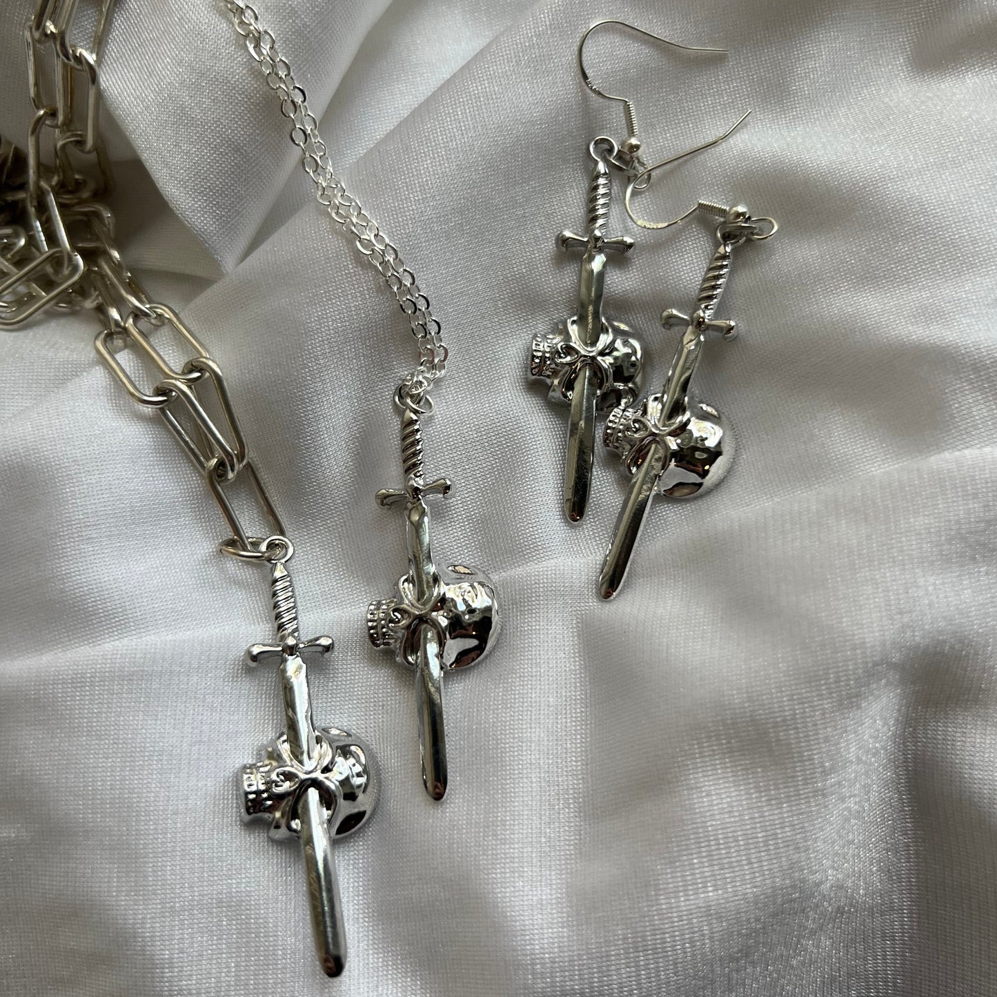 new skull sword earrings
