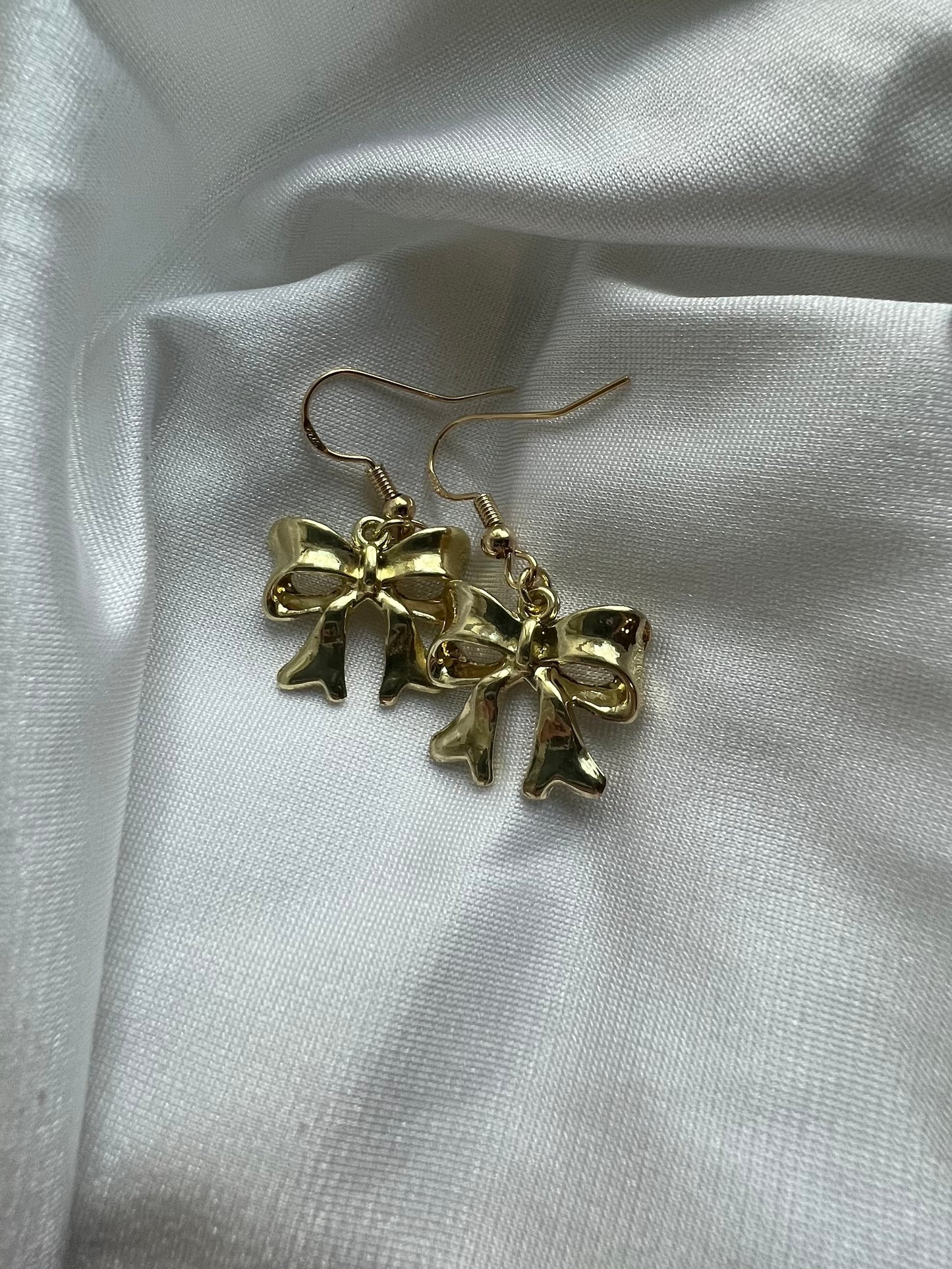 statement gold bow earrings