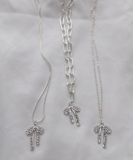 new silver intricate bow necklace