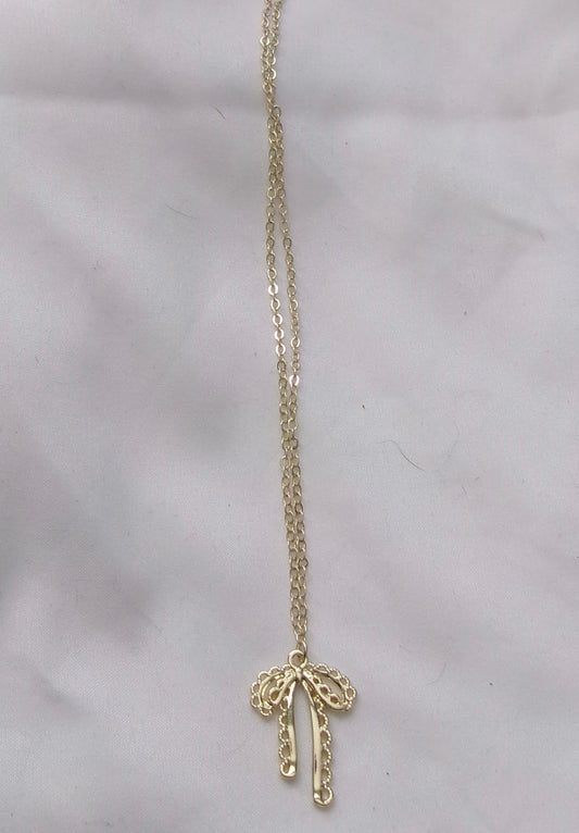 new gold intricate bow necklace